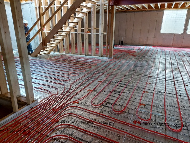 Hydronic In-floor Heating being installed into a building